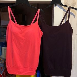 2 Under Armour tanks with built in padded bra. Size medium.